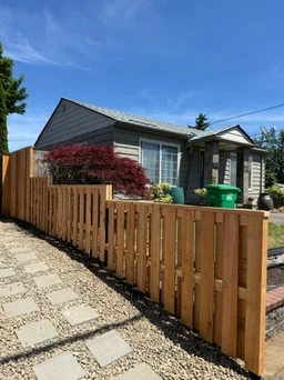 Good neighbor cedar fence along a front walk
